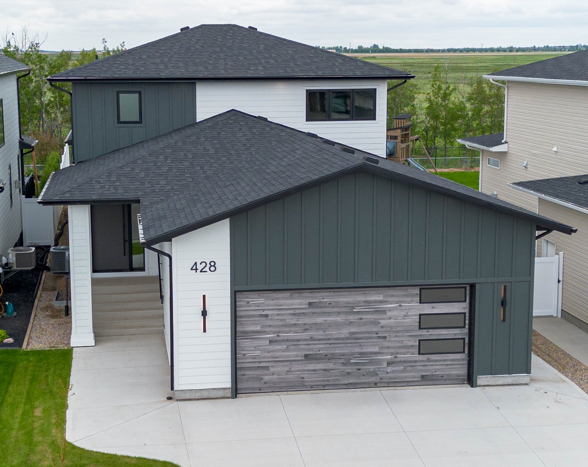 428 Woolf Bend exterior at golden hour facing the Kernen Prairie
